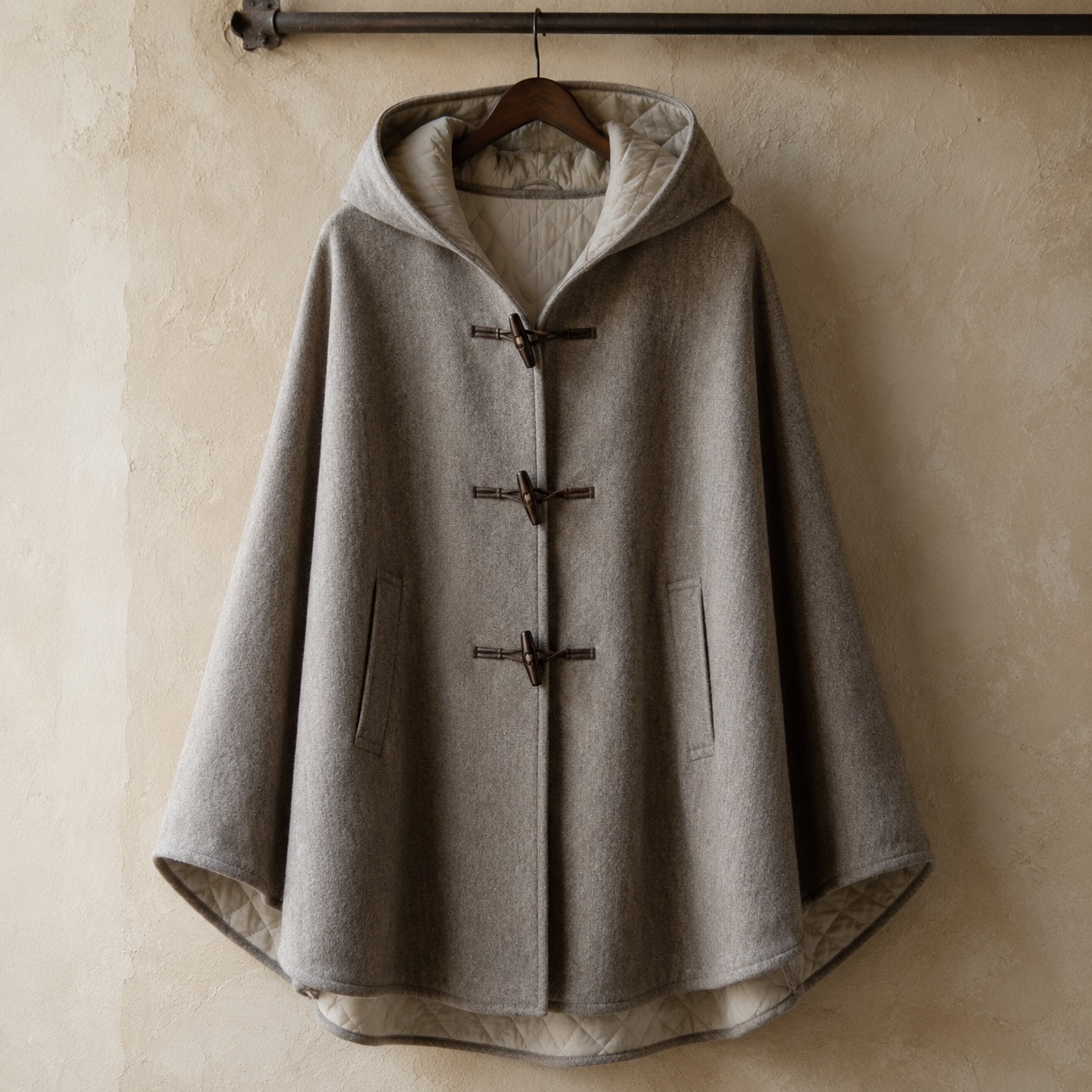 Fernhollow hooded wool cape — Down & Cape Outerwear by MASO. product photograph on a white background.