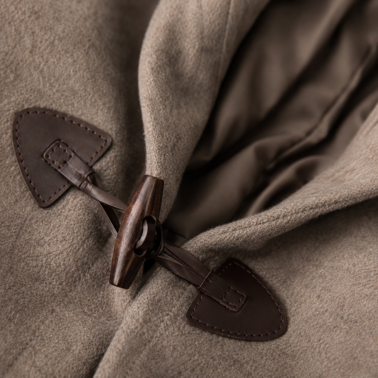 Larkspur hooded wool cape — Down & Cape Outerwear by MASO. close detail of the fabric and finish.