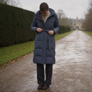 Ashcombe quilted down puffer coat — Down & Cape Outerwear by MASO. worn by a model.