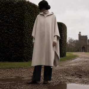 Greyfell hooded wool cape — Down & Cape Outerwear by MASO. worn by a model.