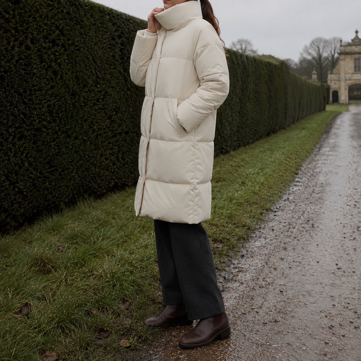 Hollowfield quilted down puffer coat — Down & Cape Outerwear by MASO. worn by a model, side view.