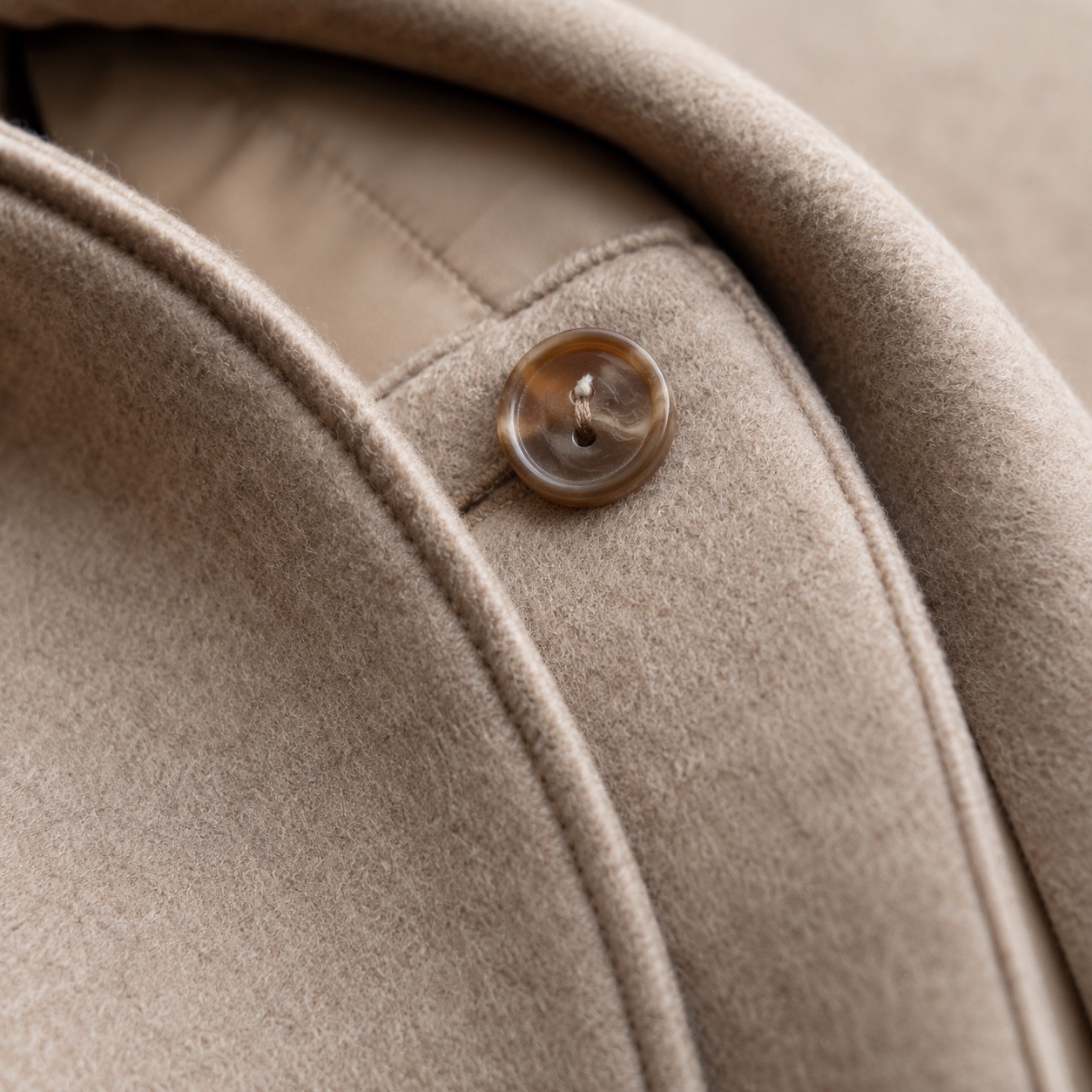 Ravenscourt hooded wool cape — Down & Cape Outerwear by MASO. close detail of the fabric and finish.