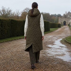 Marlowe hooded down gilet coat — Down & Cape Outerwear by MASO. worn by a model.