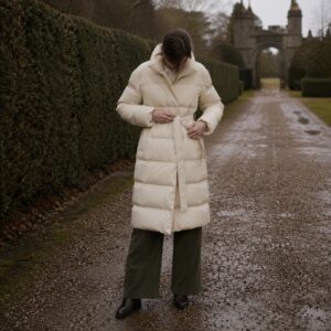 Windrush quilted down puffer coat — Down & Cape Outerwear by MASO. worn by a model.