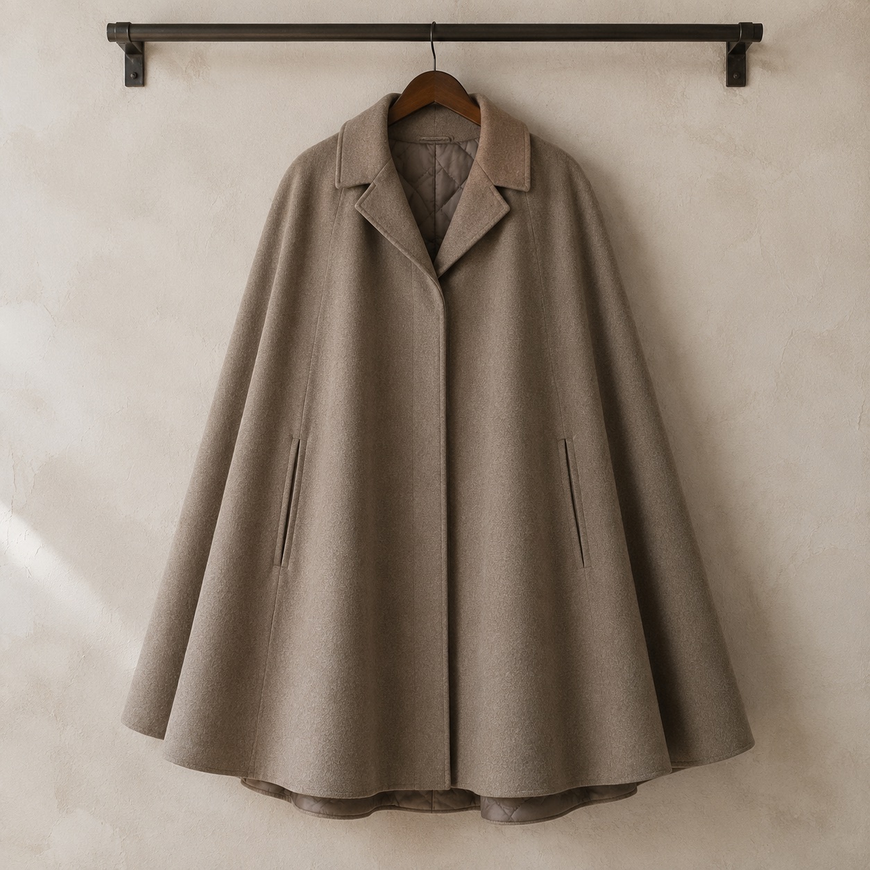 Cotswold wool cape with arm slits — Down & Cape Outerwear by MASO. product photograph on a white background.