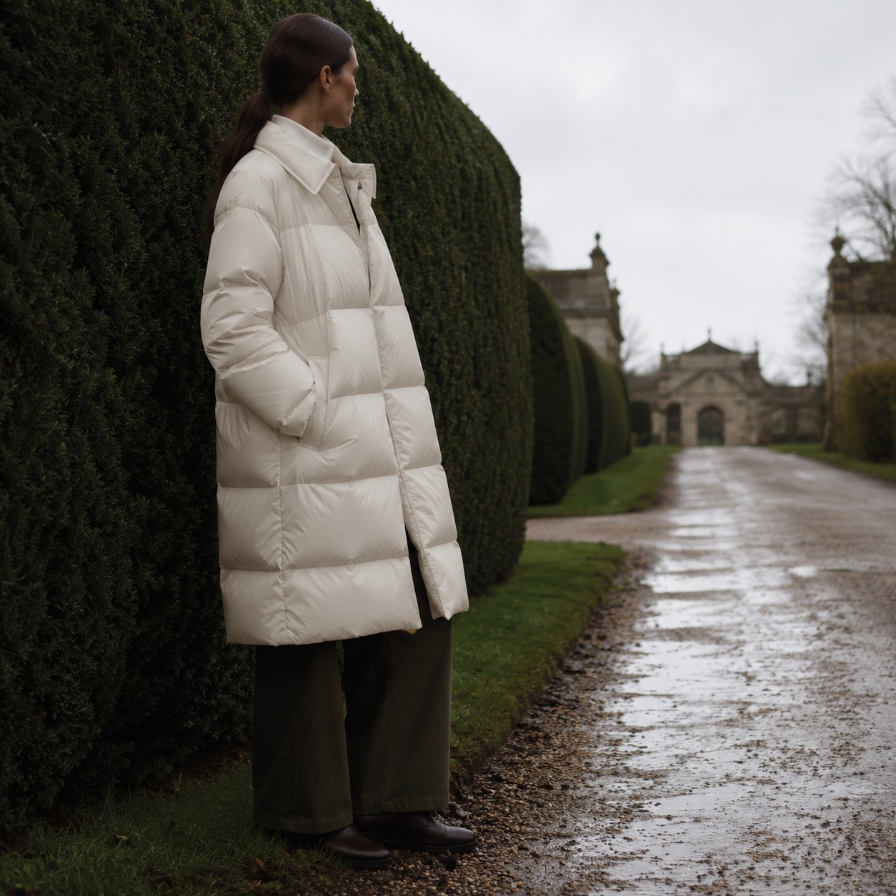 Thornleigh quilted down puffer coat — Down & Cape Outerwear by MASO. worn by a model, side view.