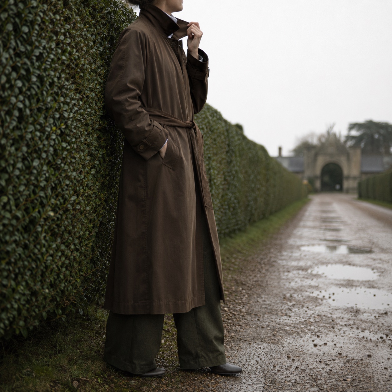 Mossgate unlined cotton trench — Trench Coats by MASO. worn by a model, side view.