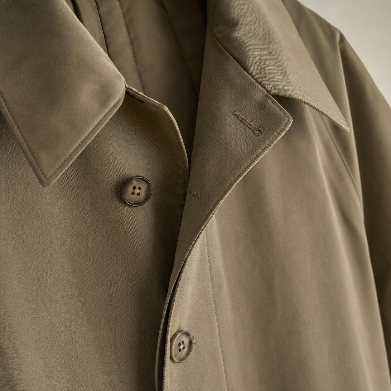 Cotswold short raglan trench — Trench Coats by MASO. close detail of the fabric and finish.
