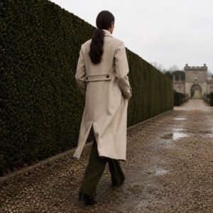 Kestrel double-breasted long coat — Wool Long Coats by MASO. worn by a model.