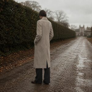 Mossgate single-breasted midi coat — Wool Long Coats by MASO. worn by a model.