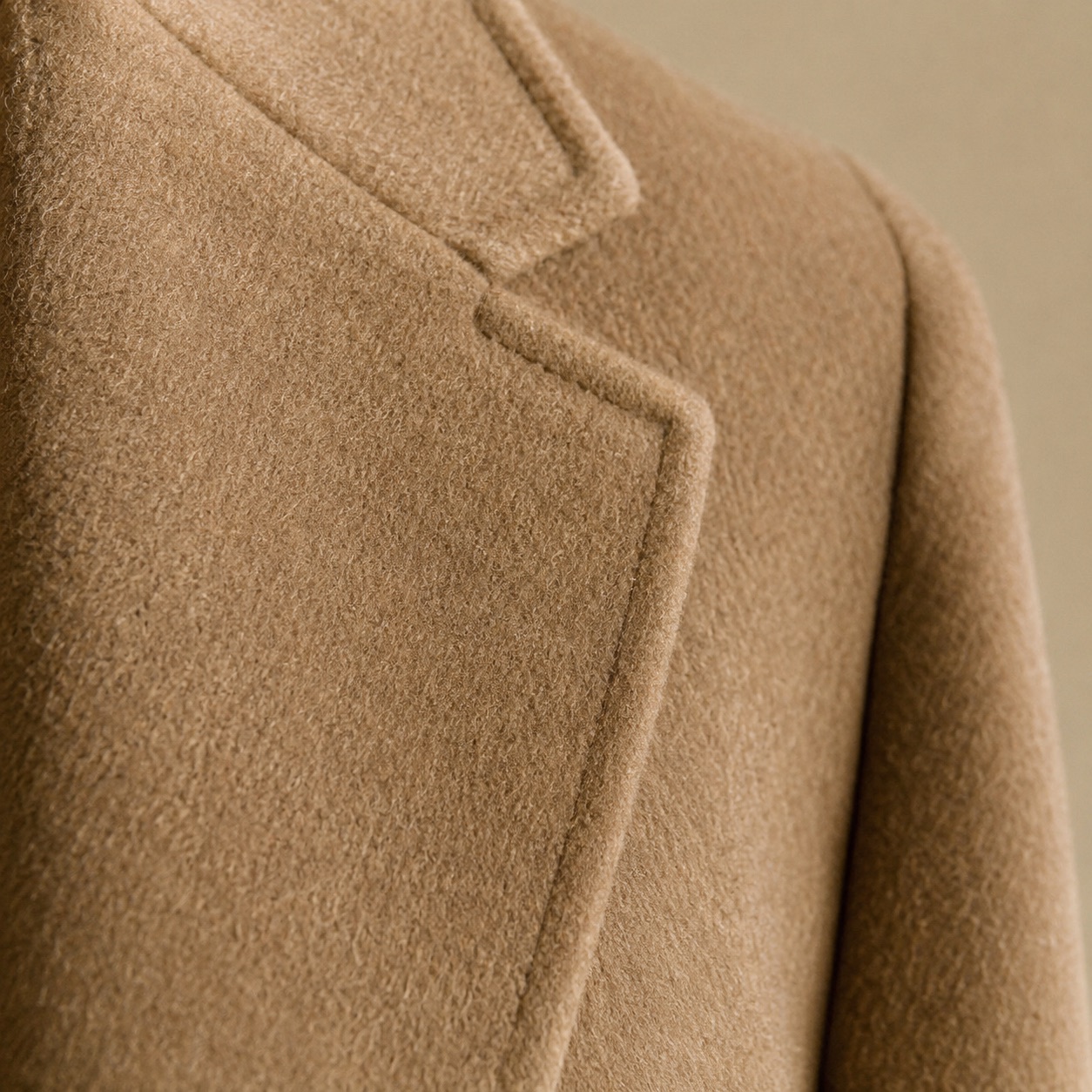 Ashcombe single-breasted midi coat — Wool Long Coats by MASO. close detail of the fabric and finish.
