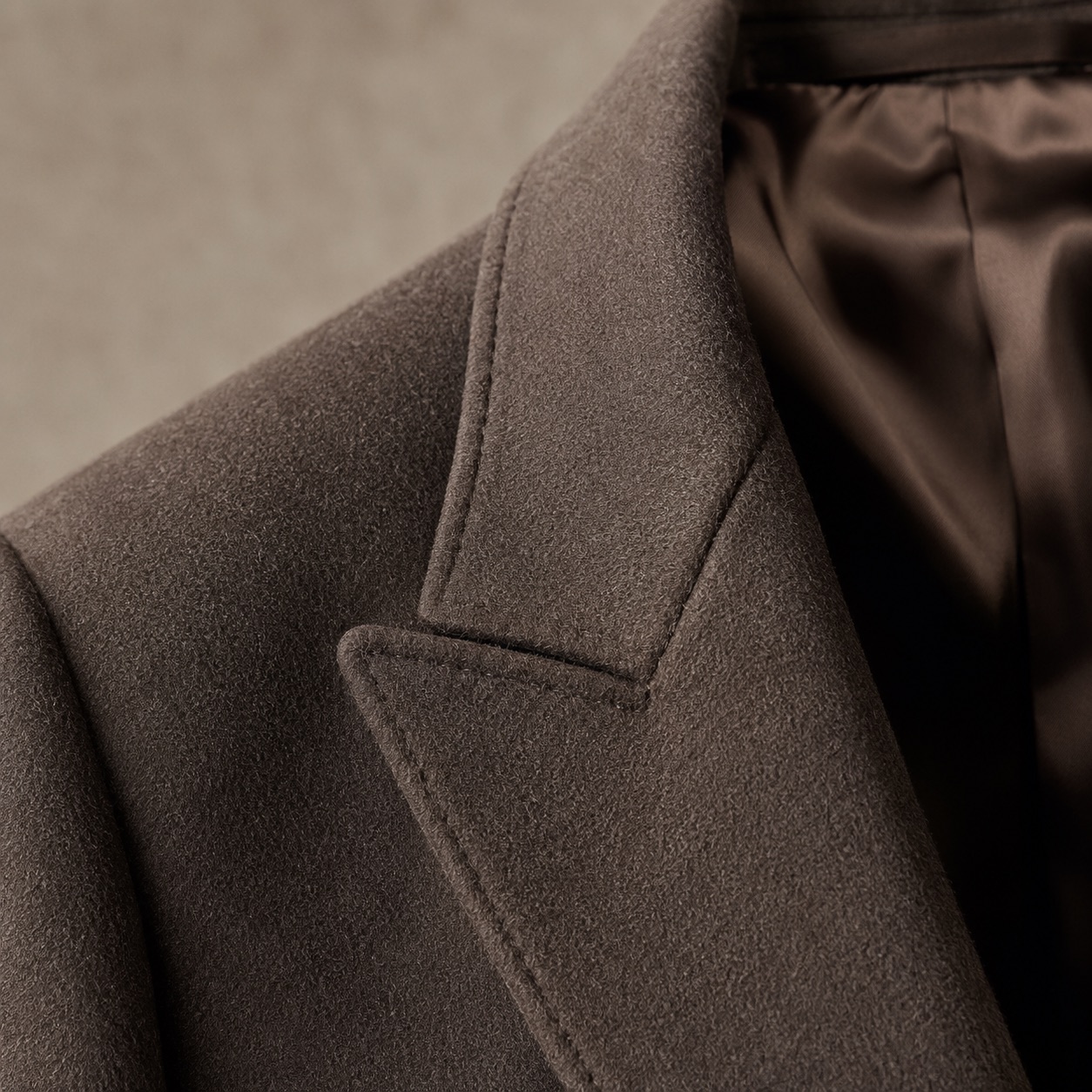 Hollowfield double-breasted long coat — Wool Long Coats by MASO. close detail of the fabric and finish.