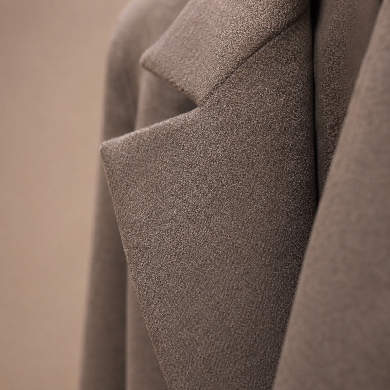 Blackthorn single-breasted midi coat — Wool Long Coats by MASO. close detail of the fabric and finish.