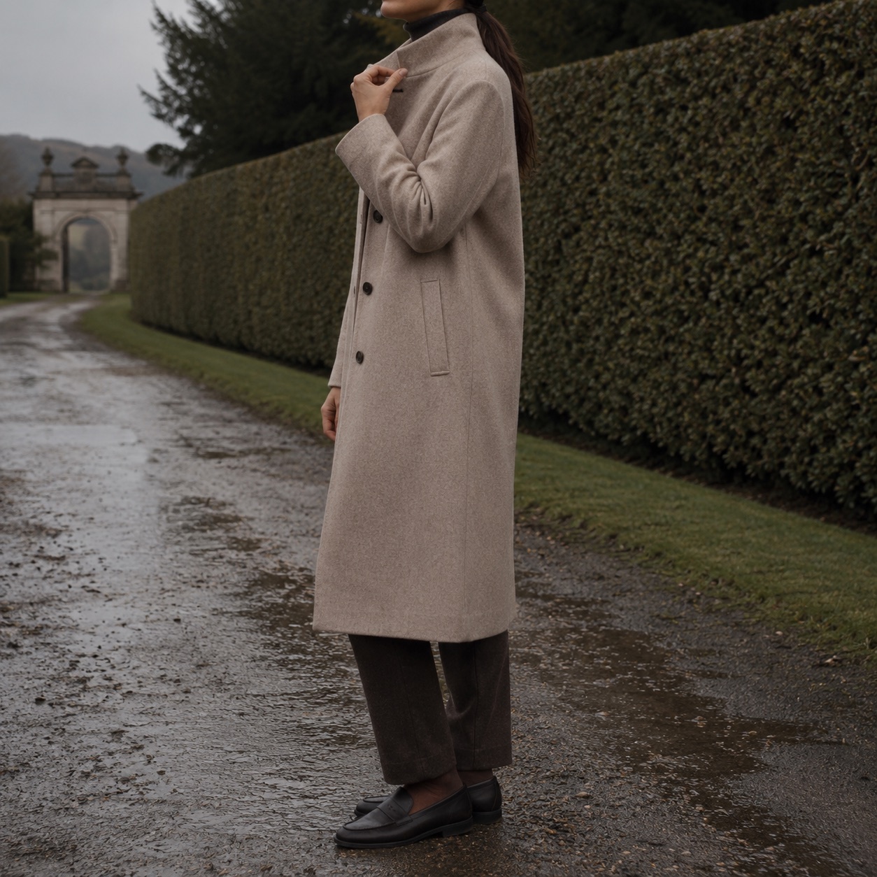 Blackthorn single-breasted midi coat — Wool Long Coats by MASO. worn by a model, side view.