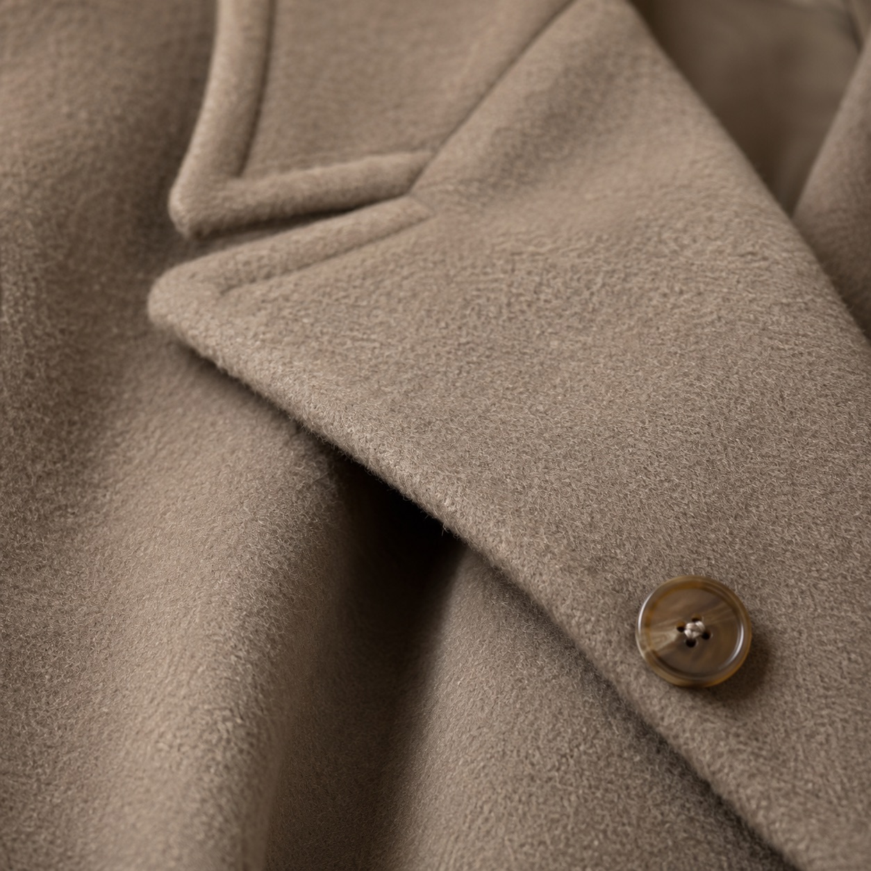 Elderwood double-breasted long coat — Wool Long Coats by MASO. close detail of the fabric and finish.