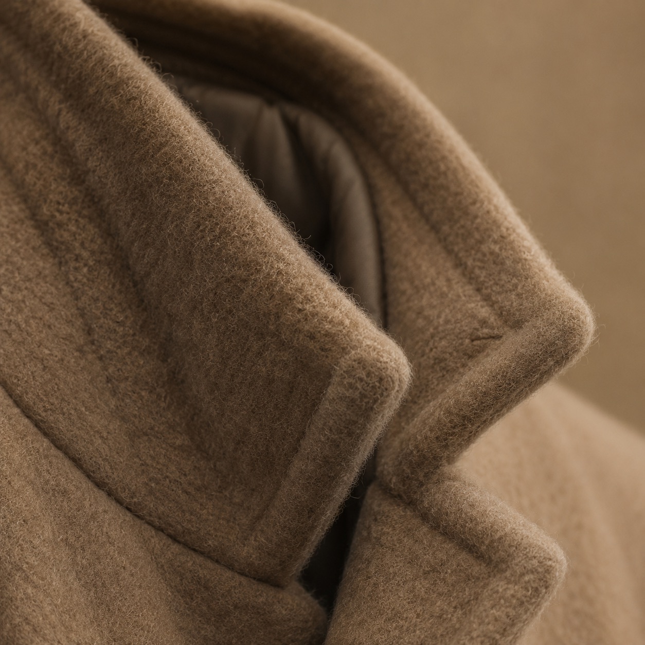 Ashcombe single-breasted midi coat — Wool Long Coats by MASO. close detail of the fabric and finish.